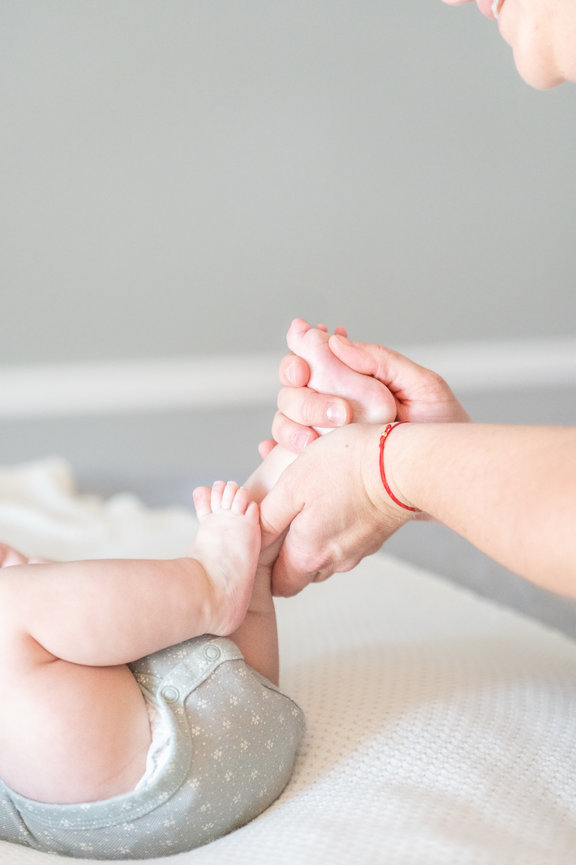 Deandra offering infant massage to a baby at her office in Greensboro, NC.