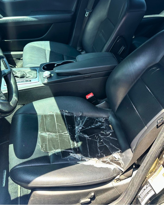 Damaged driver seat in a Mercedes C250 brought in to The Prestige Companies Auto Upholstery for repair